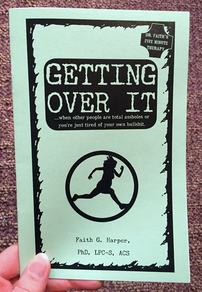 Cover of Getting Over it, which is a green zine with a person running on the cover