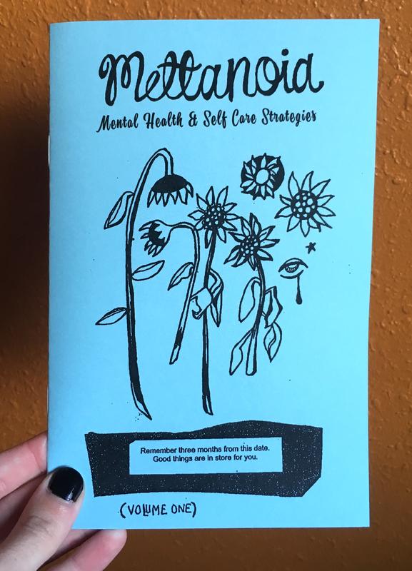 a photo of the blue Mettanoia #1 zine 